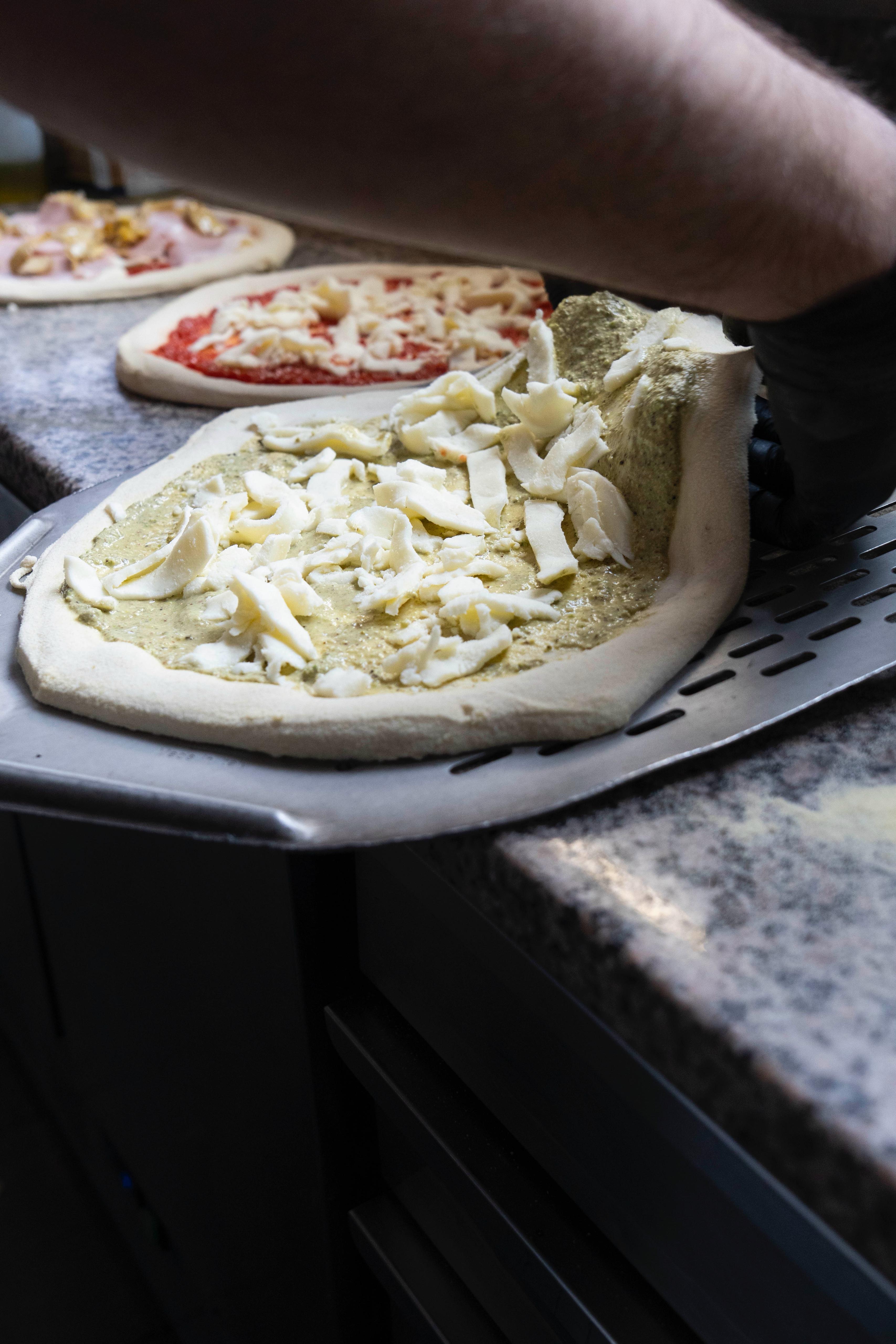Preparing pizzas for the oven at Kalura, Antwerp