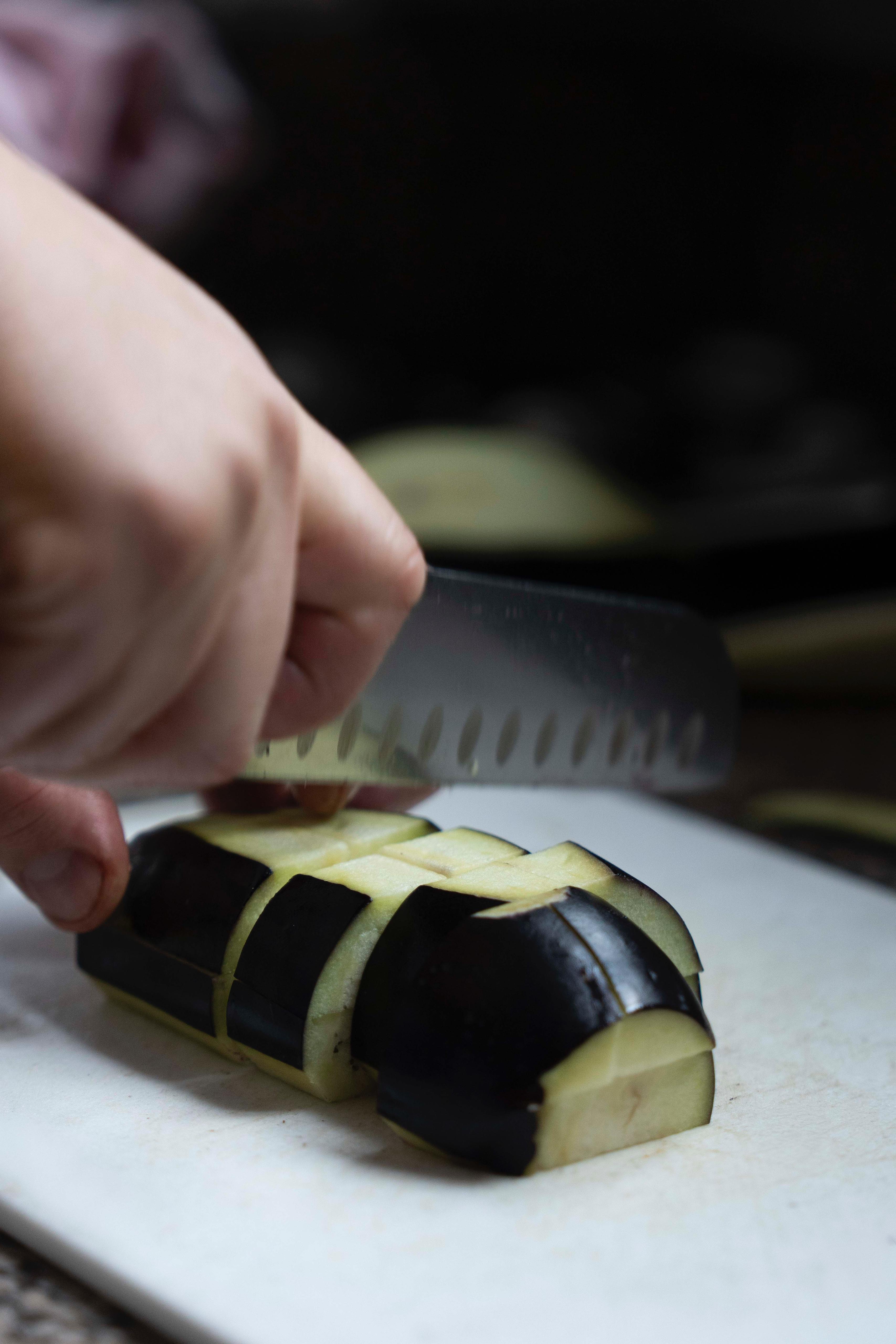 Cutting eggplant by hand at Kalura, Antwerp