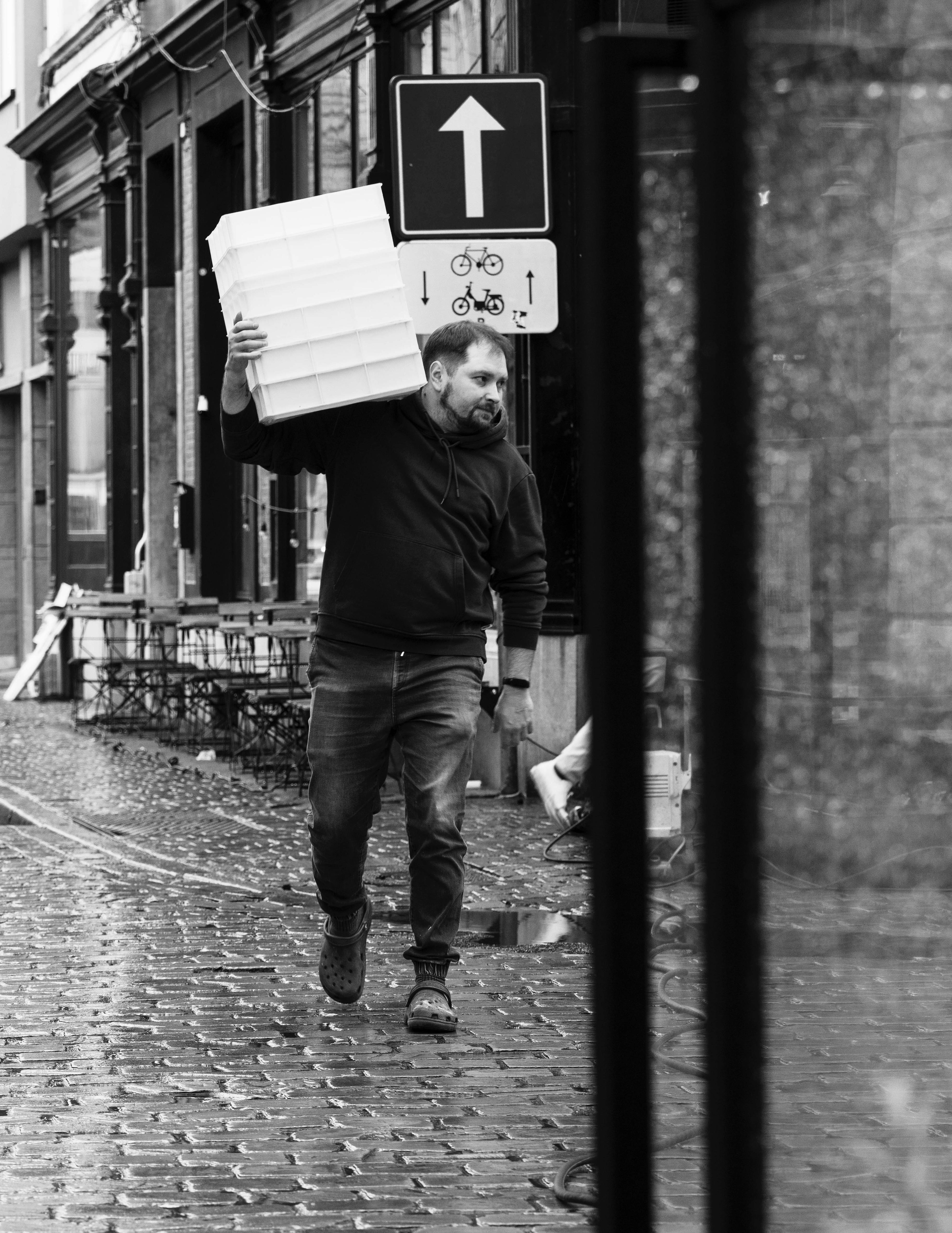 Carrying dough boxes on the street at Kalura, Antwerp
