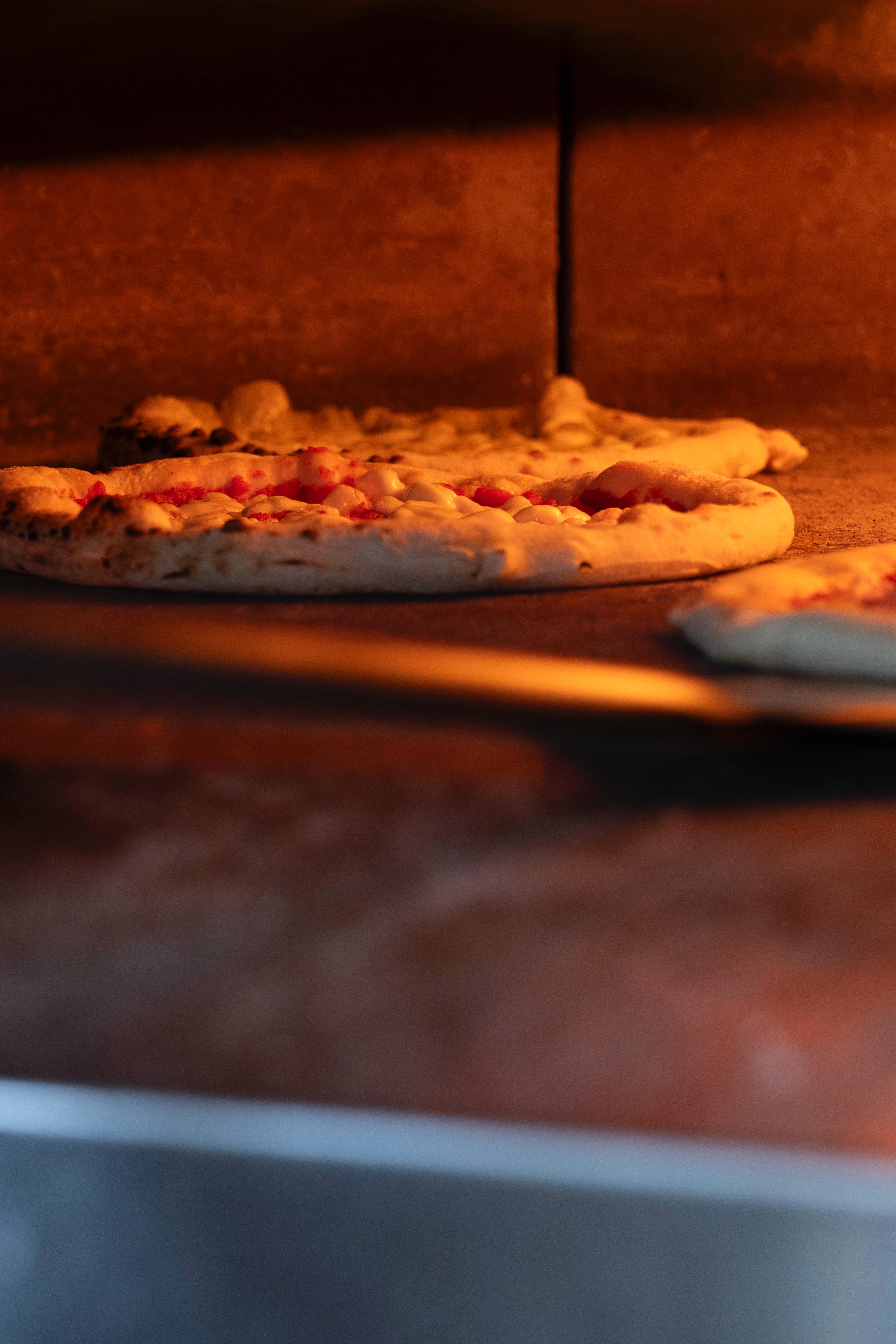 Pizza baking in the oven at Kalura, Antwerp